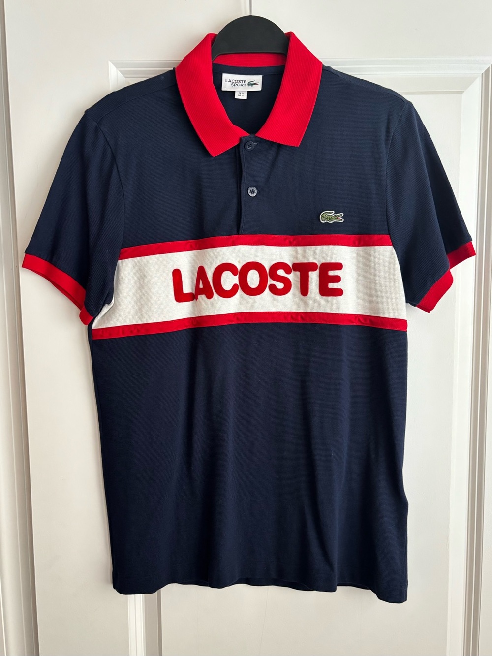 Lacoste Navy Polo with Red Trim and White Chest Panel